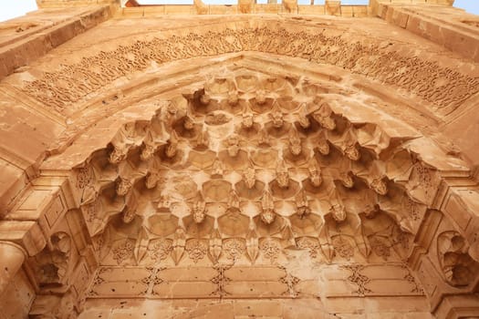 Elaborate patterns and details carved into the ottoman entrance gate, doorway of the Ishak Pasha Palace, Sarayi, Dogubeyazit, Turkey 2022