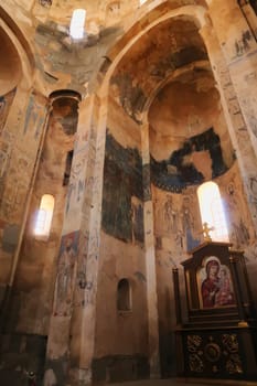 The interior of the Armenian Cathedral of the Holy Cross, vaults, christian orthodox wall paintings and frescos and an altar with an icon of Virgin Mary and baby Jesus, Akdamar Island, Lake Van, Turkey 2022