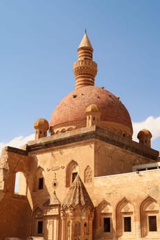 Ottoman tomb in front of the red roof, cupola, dome of the mosque in the second court inside the Ishak Pasha Palace, Sarayi, Dogubeyazit, Turkey 2022