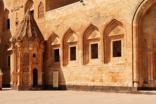 Ottoman tomb next to a row of barred windows in the second court inside the Ishak Pasha Palace, Sarayi, Dogubeyazit, Turkey 2022