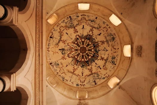 The ceiling, dome of the mosque inside the Ishak Pasha Palace, Sarayi showing wall painting, fresco with colorful patterns, Dogubeyazit, Turkey 2022
