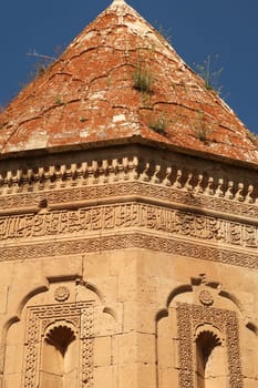 Closer look onto the facade and the roof of the Halime Hatun tomb, grave, mausoleum, Halime Hatun Kümbeti, elaborate patterns, details, carvings, close to Lake Van, Van Gölü, Gevas, Turkey 2022