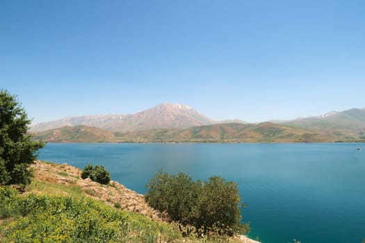 View from Akdamar Island, Lake Van, Van Gölü in the foreground and snow covered Mount Artos in the background, Van, Turkey 2022