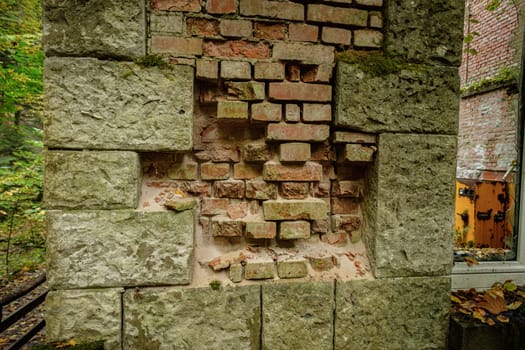 Lost place with damaged wall of hydroelectric power plant