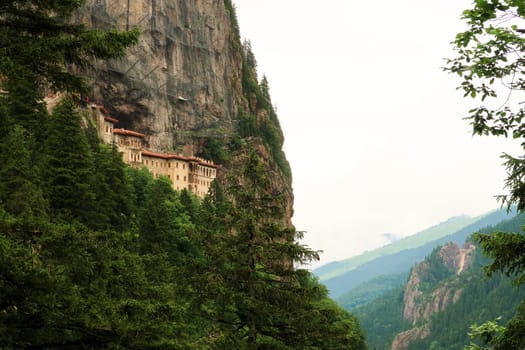 Picturesque view from the Aya Varvara Church, Kilisesi onto the Sumela, Sümela Monastery built on a cliff above a dense forest, Trabzon, Turkey 2022