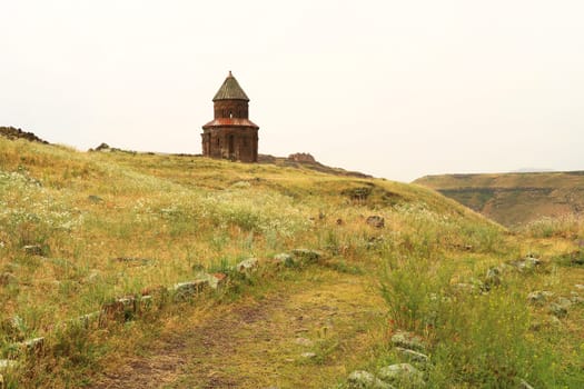 The beautiful Church of St., Saint Gregory of Abughamir, Abughamrens, Abughamrents surrounded by meadows at the ancient site of Ani, an abandoned ruined armenian city, close to Kars, Turkey 2022