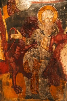 Colorful ceiling painting, fresco, wall painting showing St. Ignatius of Antioch being eaten by lions inside the Rock Church at Sumela, Sümela Monastery, Trabzon, Turkey 2022