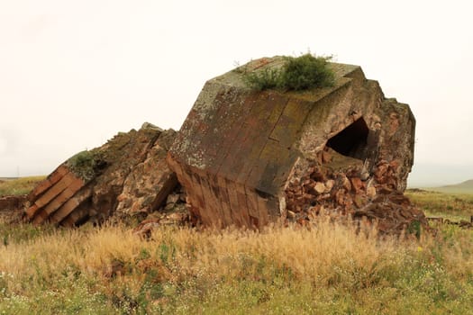 The ruins of the fallen minaret at the ancient site of Ani, an abandoned ruined armenian city, close to Kars, Turkey 2022
