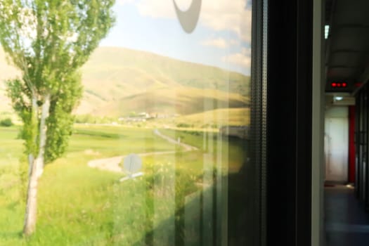 The picturesque landscape seen on the train ride in the Eastern Express, Dogu Ekspresi from Kars to Ankara, the interior of the train and its front are both visible, Turkey 2022
