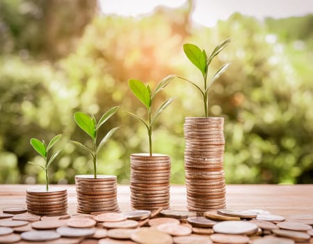 Coins stacked next to each other against a bright green background. Concept wealth, money growth