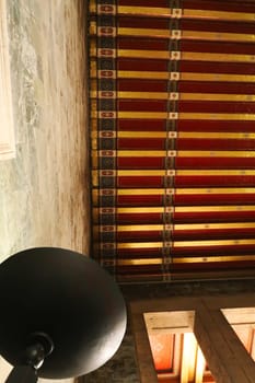 The colorful gold and red ceiling, columns and a black lamp shade inside the Hall of Honor, the mausoleum that houses the tomb, grave, coffin of Mustafa Kemal Atatürk, Ataturk at the Anitkabir monument, memorial, complex, Ankara, Turkey 2022