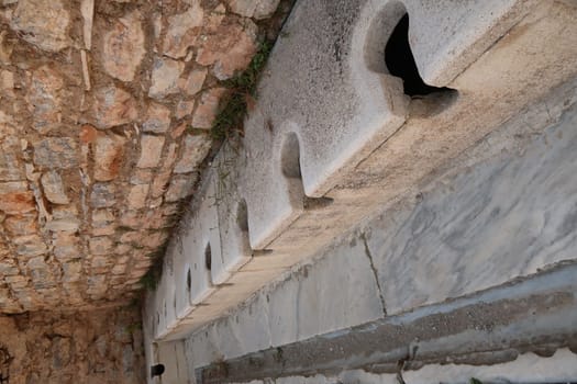 Roman toilets at the archaeological site of Ephesus near Selcuk, Turkey 2022