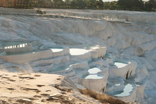 Steam coming up from the reflecting hot water in the travertines of Pamukkale early in the morning, Denizli, Turkey 2022