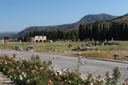The ancient ruins of Hierapolis next to Pamukkale with the Domitian Gate and the Frontinus Street in the background, Denizli, Turkey 2022