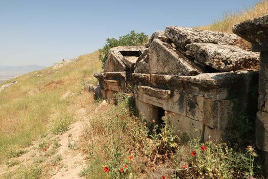 Row of three sunken tombs at the upper Necropolis of the ancient site of Hierapolis, Pamukkale, Denizli, Turkey 2022