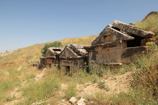 Row of three ancient tombs at the upper Necropolis of the archaeological site of Hierapolis, Pamukkale, Denizli, Turkey 2022