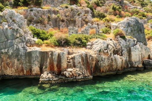 Remaining wall onshore with doorway at the ancient sunken city of Kekova, Kekova Island, Demre, Turkey 2022