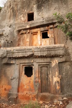 Lycian rock hewn, rock cut tomb above the coastal town of Kas, Turkey 2022