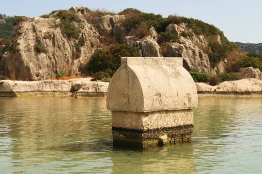 Lycian Sarcophagus in the shallow water close to the harbor of Kaleköy, close to Demre, Turkey 2022