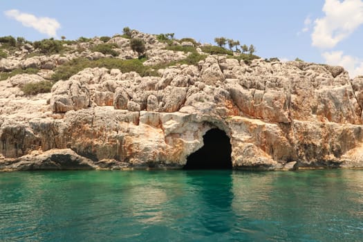 The fascinating Pirate Cave or Blue Cave on Asirli Island in the Gökkaya Bay close to Demre, Turkey 2022