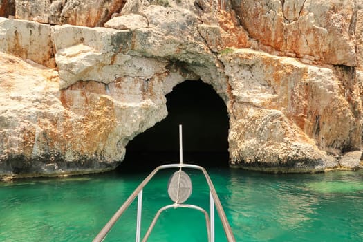 Approaching the famous Pirate Cave or Blue Cave on Asirli Island in the Gökkaya Bay on our Kekova Island boat trip, close to Demre, Turkey 2022