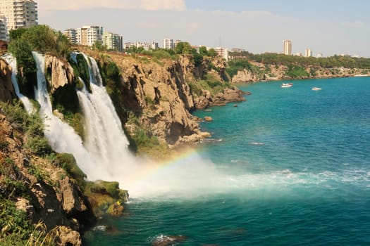 The beautiful Lower Düden Waterfalls in Antalya with a rainbow right next to them, Antalya, Turkey 2022