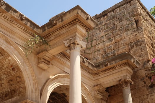 Details on the upper part of the Hadrians Gate, famous ancient roman monument in Antalya, Turkey 2022