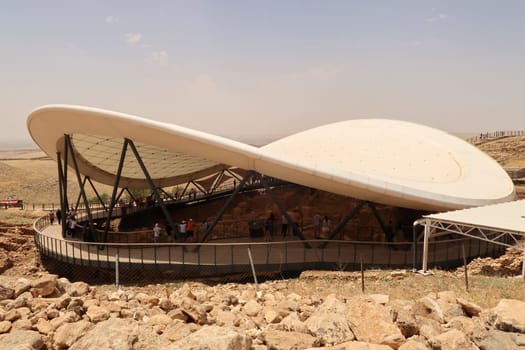 View onto the protective roof and the wooden walkway build around the neolithic archaeological site of Göbekli Tepe, Sanliurfa, Turkey, 12th of June 2022
