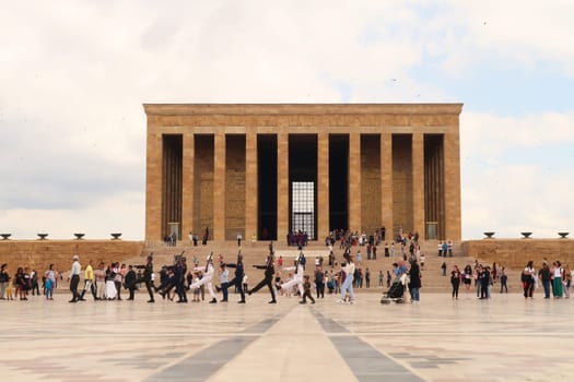 Turkish soldiers are marching on the Ceremonial Plaza of the Anitkabir complex, monument, memorial with the Hall of Honor in the background, housing the tomb of Atatürk, Ataturk, Ankara, Turkey, 1st of July 2022