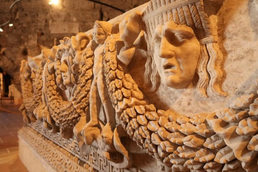 Elaborate reliefs on a roman sarcophagus at the Hierapolis Museum, Pamukkale, Denizli, Turkey, 20th of May 2022