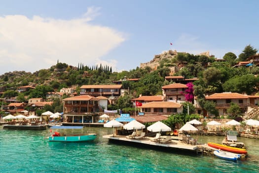 The beautiful coastal town of Kaleköy, ancient town of Simena seen from the boat on our Kekova Island Tour, near Demre, Turkey, 27th of May 2022