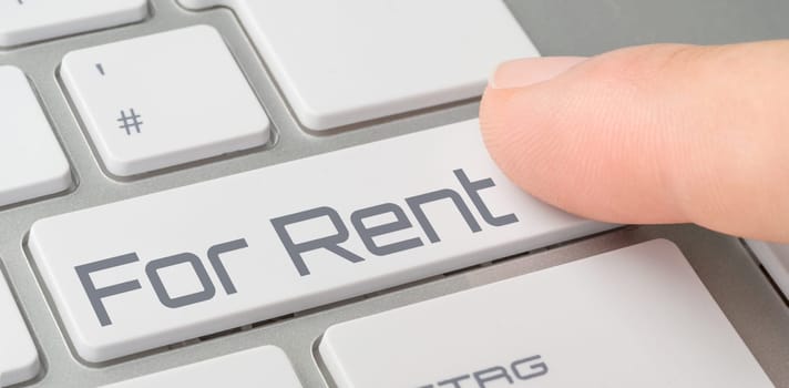 A keyboard with a labeled button - For Rent