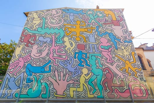 Pisa, Italy - 29 June 2023: Tuttomondo (All World) is the last mural created by American artist Keith Haring in 1989 before his death.