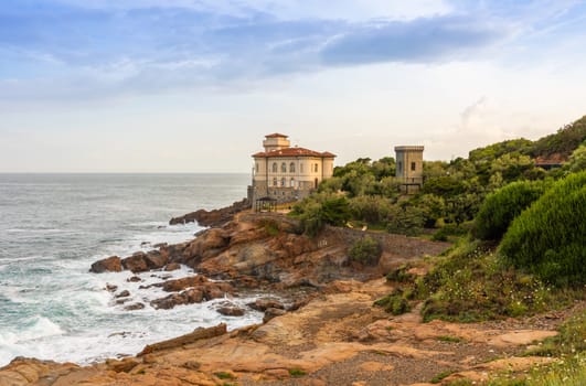 Livorno, Italy - 01 July 2023: Boccale Castle, seascape sunset. Rock and sea water.