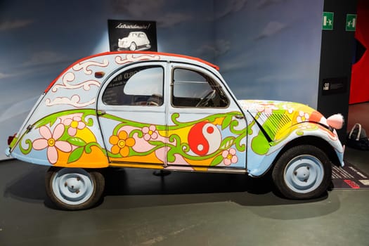 Turin, Italy - 11 november 2023: Car Museum. Citroen 2 CV, 1958. Vintage icon of hippies travel, adventure, peace.