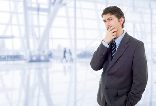 young business man thinking, at the office