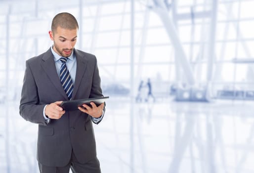 young businessman working with a tablet pc, at the office