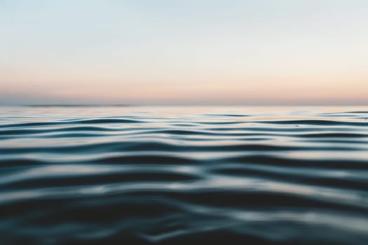 A serene body of water reflects the ever-changing colors of the sky in the background, creating a mesmerizing and harmonious scene.
