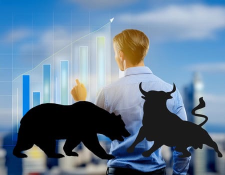 The animals of the stock exchange, bull and bear, face each other brightly on the stock exchange.