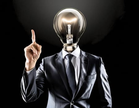 Creative light bulb: A headless man with his light bulb head glowing symbolizes a brilliant idea.