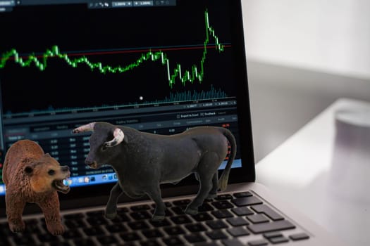 The animals of the stock exchange, bull and bear, face each other brightly on the stock exchange.