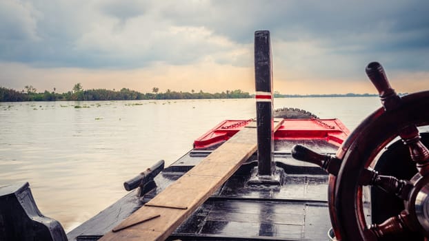 Traveling by boat on Co Chien River in Southern Vietnam