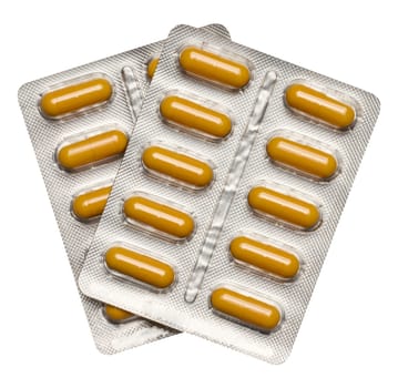 Oval tablets in aluminum blister pack on isolated background, top view