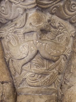 Romanesque portico of Church of Crucifijo, Puente La Reina, Navarre, Spain. Capital decorated  with linked necks geese
