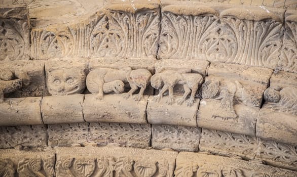 Romanesque portico of Church of Crucifijo, Puente La Reina, Navarre, Spain. Decorated archivolt with griffin