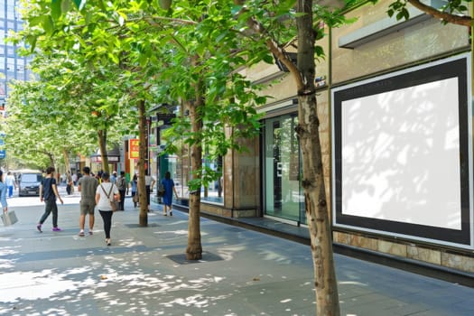 A diverse group of individuals is walking down a sidewalk lined with towering trees in an urban setting, embodying a spirit of exploration and unity.