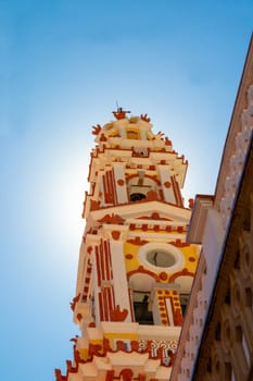 SYMI, Greece - JUN 03, 2021. SYMI, Greece - JUN 03, 2021.   Bell tower a part of Panormitis monastery Archangel Michael in the southwest of the island of Symi. An important Orthodox pilgrimage site.