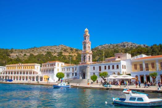 SYMI, Greece - JUN 03, 2021. SYMI, Greece - JUN 03, 2021. Panormitis Monastery of Archangel Michael in the southwest of the island of Symi is an important orthodox pilgrimage site and an important tourist attraction.