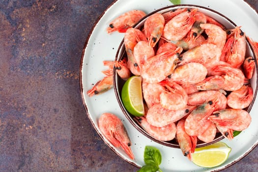 Fresh raw shrimps or prawns in bowl. Space for text.