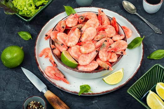 Fresh raw shrimps or prawns in bowl. Space for text.